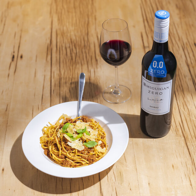 McGuigan Zero Shiraz bottle and glass with a bowl of pasta image number null